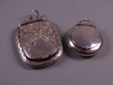 A BRIGHT CUT SILVER PENDANT LOCKET with end hinged lid and all over scroll decoration, Birmingham