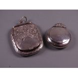 A BRIGHT CUT SILVER PENDANT LOCKET with end hinged lid and all over scroll decoration, Birmingham