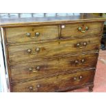 AN EARLY 19th CENTURY MAHOGANY CHEST of two short over three long oak lined drawers, having swan