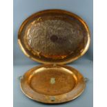 AN ARTS & CRAFTS STYLE OVAL COPPER TRAY and one other having embossed central interlace design and
