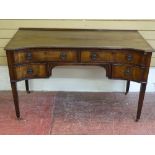 A REPRODUCTION REGENCY STYLE MAHOGANY DESK, the shaped front having an arrangement of four drawers