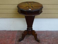 A VICTORIAN INLAID MAHOGANY WORK BOX TABLE with star inlay to the top and segmented column, on a