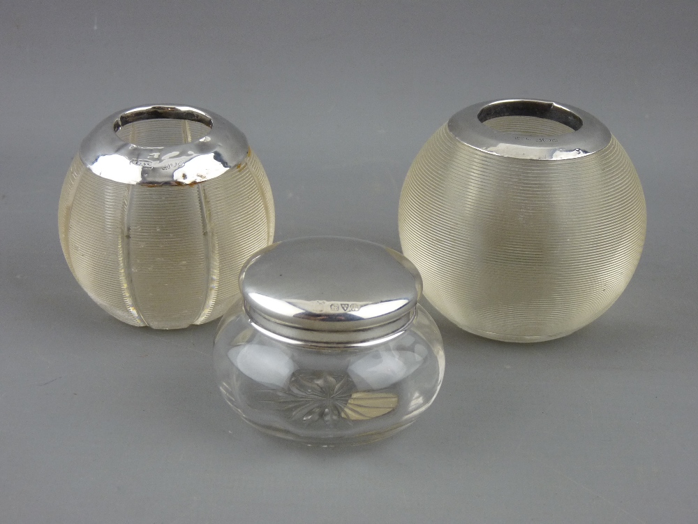 TWO GLOBULAR GLASS MATCH STRIKERS with silver rims and a small dressing table glass pot with Chester