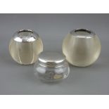 TWO GLOBULAR GLASS MATCH STRIKERS with silver rims and a small dressing table glass pot with Chester