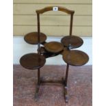 A VINTAGE MAHOGANY METAMORPHIC CAKESTAND, patent label attached 'THE MONOPLANE', 77 cms high
