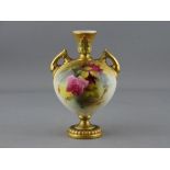 A ROYAL WORCESTER TWIN HANDLED VASE, 2249 shape, gilt decorated with floral body, 16 cms high