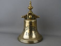 A BRONZE SHIP'S BELL marked 'Bolivia 1849' (clapper missing), 28 cms high, 18.25 cms diameter,