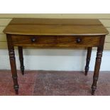 A VICTORIAN MAHOGANY TWO DRAWER SIDE TABLE on turned supports, 77 cms high, 101 cms wide, 50.5 cms