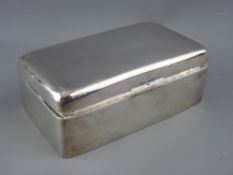 A RECTANGULAR SILVER CIGARETTE BOX, the lid with engine turned decoration, 13.5 cms long,