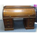 A VICTORIAN MAHOGANY TWIN PEDESTAL CYLINDER FALL BUREAU, the interior with slide-out work surface