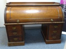 A VICTORIAN MAHOGANY TWIN PEDESTAL CYLINDER FALL BUREAU, the interior with slide-out work surface