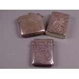 A BRIGHT CUT SILVER VESTA CASE with all over floral decoration, Birmingham 1886 and two