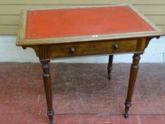 A VICTORIAN MAHOGANY SINGLE DRAWER WRITING TABLE with red leather and gilt tooled insert on turned