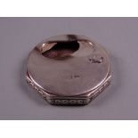 AN OCTAGONAL SILVER ASH CONTAINER with Celtic style edging and with swivel lid for interior