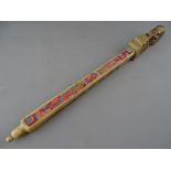 A CHINESE CARVED SOAPSTONE OPIUM OR TOKE PIPE with stained colour highlighting and seal script