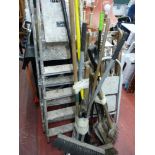 Parcel of long handled garden tools, wooden and metal stepladders and a Flymo Glider 350 lawnmower
