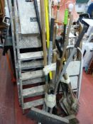 Parcel of long handled garden tools, wooden and metal stepladders and a Flymo Glider 350 lawnmower
