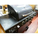 Excellent Uniflame gas powered BBQ, model no. GBC1440WPE-U and two metal framed garden recliners