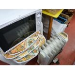 Small white microwave oven and an electric oil filled heater E/T