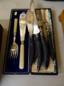 Cased set of fish servers and a seven piece horn handled carver set