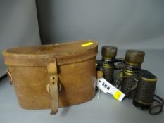 Pair of Fournier 8x26 binoculars in a leather case