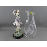 Stylish glass jug and a composite figurine of a pixie from the Leonardo Collection