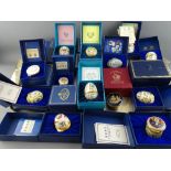 Good collection of boxed mainly Halcyon Days enamel pill boxes and collectable eggs with a