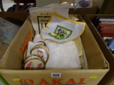 Box of vintage linen and needlework pictures