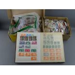 Small album and two boxes of unsorted postage stamps