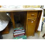 Mid Century polished wood drop leaf dining table with end cupboard and drawer