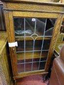 Small polished wood leaded glass single door display cabinet with three interior shelves