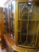 Polished dark wood display cabinet with lower base cupboards and a glazed top corner unit with