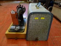 Vintage Singer manual sewing machine with case