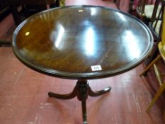Well polished antique mahogany tilt top tripod table with circular tray top