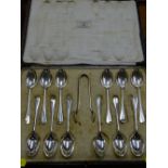 Cased set of twelve Mappin & Webb silver teaspoons and sugar tongs, Sheffield 1922