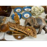 Carved treen to include an African elephant, a group of rhinos, two vintage ladles etc