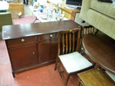 Stag mahogany dining suite of extending circular table, six (four plus two) chairs and sideboard