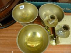 Three brass finger bowls and a pair of open twist candlesticks