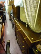 Mid Century walnut bedroom set of mirrored dressing table, three drawer chest and bedside cabinet