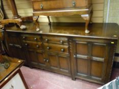 Priory style oak long sideboard