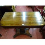 Antique rosewood foldover card table with baize lined interior on a beaded column stem and