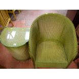 Lloyd loom style armchair and a similar glass topped linen basket