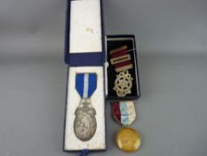 Three Masonic precious metal jewels, two hallmarked silver the other in a nine carat gold mount