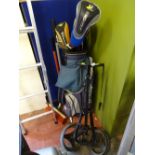 Golf trolley with Dunlop bag containing quantity of golf clubs and a small selection of long handled