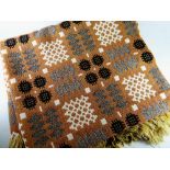 A GOOD TRADITIONAL WELSH WOOLEN BLANKET of brown ground with black, grey and white geometric