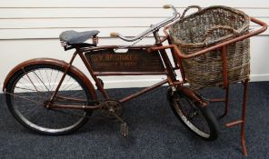 A VINTAGE RALEIGH CHIMNEY SWEEP'S BIKE FOR SV BRUNKER OF CARDIFF complete with oversize wicker