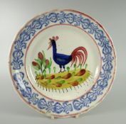 A LLANELLY COCKEREL PLATE typically decorated with sponged flowers to the border, 25cms diam