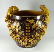 A RARE EWENNY POTTERY JARDINIERE SIGNED BY WILLIAM DOEL decorated with brown glaze over honeycomb