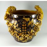 A RARE EWENNY POTTERY JARDINIERE SIGNED BY WILLIAM DOEL decorated with brown glaze over honeycomb