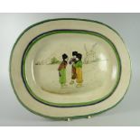 A LLANELLY POTTERY 'DUTCH BOYS' PLATTER with the three boys in conversation while smoking with